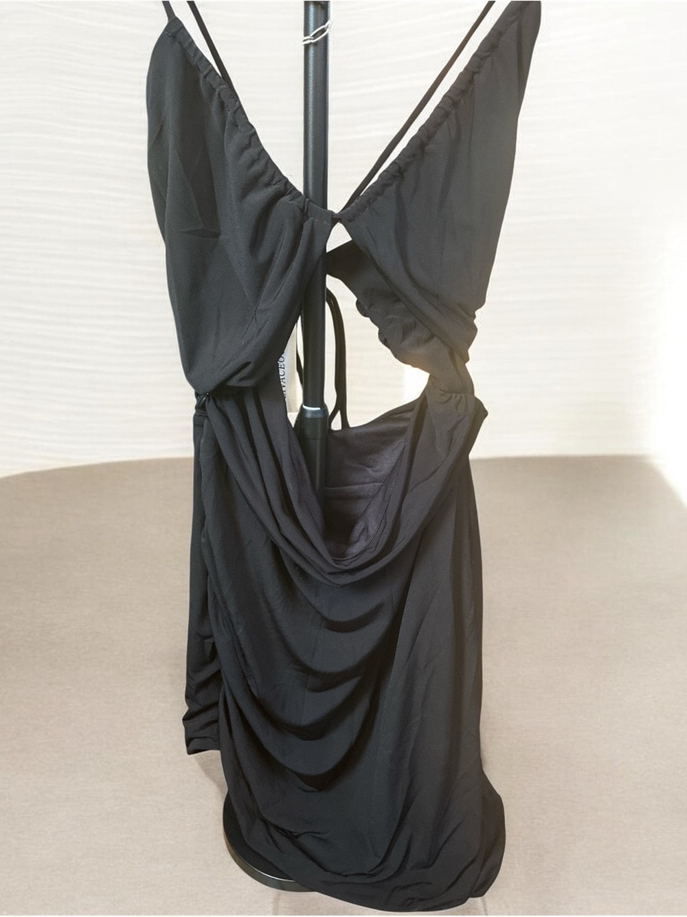 Olivaceous Black mini bodycon dress with thin straps in the back. NWT size large